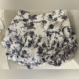 Misa white ruffle skirt with navy blue floral pattern